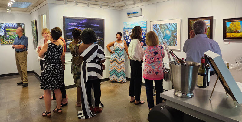 Guests at an ARTclectic Art Exhibition Opening Reception